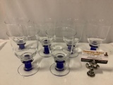 Set of 6 goblet style drinking glasses w/ blue stem, approx 4 x 6 in.