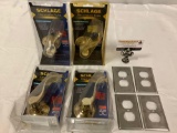 8 pc. lot of metal home accessories: outlet plates, Schlage door handles in package.