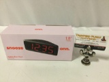 Snooze Onn. digital AM / FM radio alarm clock in box.