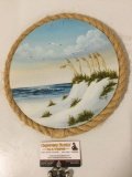 Original circular canvas beach scene painting signed by artist Ruth w/ rope frame, approx 11 in.