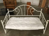 White metal day bed w/ mattress topper, good condition, approx 80 x 40 x 50 in.