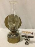 Antique oil lamp w/ metal grip holder, approx 6 x 6 x 13 in. Handle needs repair, sold as is.