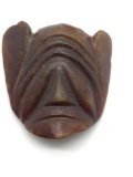 Fine carved Chinese old brownish jade mask pendant.