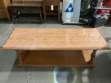 Vintage wood coffee table, approximately 60 x 23.5 x 15 in. Shows finish wear.