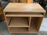 Pine wood rolling entertainment center w/ 2 pull-out shelves, approx 20 x 33 x 30 in. Shows wear.