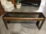 Wood frame brown tinted glass top hall table, approximately 17 x 59 x 26 in. Nice condition. INV