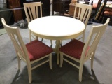 Modern round wood table w/ 4 matching chairs, approx 44 x 30 in. Nice condition.