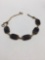 Very nice antique sterling silver bracelet with black onyx settings