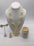 Carved bone ? Set elephant necklace, ring , clip on earrings, expandable cuff bracelet
