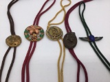Very unusual selection of 5 metal art bolo pendants with ties
