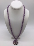 Beautiful amethyst necklace with a hand blown clear and purple pendant