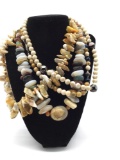 Selection of polished stones and beaded necklaces