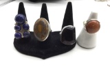 4 large heavy marked .925 silver rings with various stones
