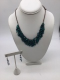 Matching turquoise colored fashion necklace with matching earrings