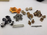 Collection of vintage metal and rhinestone brooches and earrings