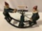 Antique cast-iron clowns on teeter totter painted metal toy, approx 9 x 7 x 3 in.