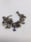 Antique sterling or .900 coin silver charm bracelet , most of the charms are marked