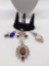 4 larger pendants all marked .925 on clasp w/ a .925 silver ring various stones