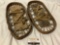 Antique wood snow shoes w/ rope/canvas bindings, approx 19 x 9 x 2 in.