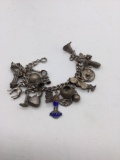 Antique sterling or .900 coin silver charm bracelet , most of the charms are marked