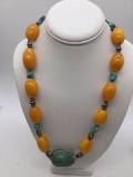 Large necklace with pressed Amber , turquoise nuggets and a hand carved scarab
