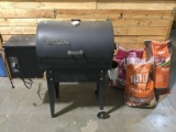 TRAEGER wood pellet grill / smoker w/ 3 bags of hardwood pellets, approx 38 x 36 x 15 in. INV 2218