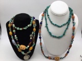 Nice selection of 4 necklaces turquoise, Amber, coral, assorted stones and carved bone pendants