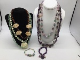 6 necklaces and 2 bracelets, carved bone , wire wrapped stones , amethyst, jade?