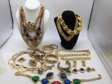 Large selection of large gold toned fashion jewelry necklaces, bracelets, brooches, earrings