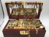 Wooden Asian themed jewelry box filled with jewelry, necklaces, rings, watches, earrings