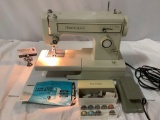 Vintage KENMORE sewing machine model number 15812111, with pedal, instruction book, accessories,