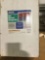 Box of unused wall mounted storage bins 12 blue and 18 red