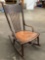 Antique wood child size rocking chair, approximately 27 x 17 x 31 in.