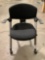 Rolling office chair, seat shows wear, approx 24 x 19 x 32 in.