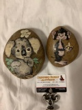 2 pc. lot of hand painted animal character stones by Rhee, koala bear, monkey w/ banana, approx 6 x