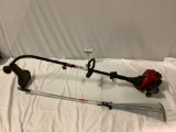 2 pc. lot of lawn tools: Craftsman gas powered wire trimmer , Barnel ultra reach rake. Sold as is.