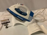 ORECK Cord free steam iron with booklet and stand, approx 13 x 10 in.