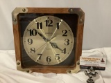 Spartus - Quartz clock w/wood case, approx 11 x 11 x 3 in.