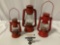 3 pc. lot of antique red metal lanterns made in Japan; Winged Wheel no. 350 / no. 400, Sun Brand no.