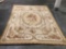 Large knitted wool floor covering / tapestry w/ floral design, approx 104 x 140 in.