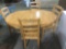 Nice oak dining room table with four matching chairs / Solid set