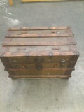 Antique steamer trunk with wooden slats and modified cedar lining inside trunk