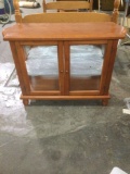 Wooden small lighted display cabinet with glass shelf