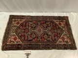 Antique hand woven wool rug, made in Iran, approximately 47 x 27 in.