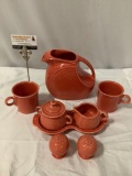 8 pc. set of red Homer Laughlin Co. Fiesta ceramic tableware; pitcher, creamer, sugar, mugs,