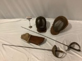 5 pc. lot of antique fencing equipment; 2x epee / swords, 2x face mask, 1 glove. Approx 41 x 8 in.