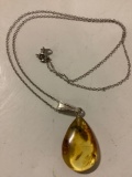 Fine authentic fossil amber pendant with insect inclusion on sterling silver necklace