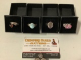 Collection of four fine vintage sterling silver rings with stones and display boxes.