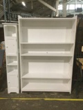 Large real word white bookshelf with adjustable shelves and small knickknack storage shelf