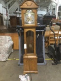 Very nice better quality Howard Miller grandmother clock complete w/ pendulum and weights